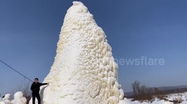 Water spraying out of abandoned well freezes into 10-metre-high 'ice tower' in northern China