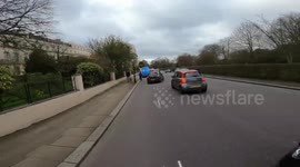 BMW driver tried to jump the queue by driving on the wrong side of the road.