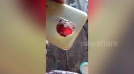 Thai woman finds bizarre glowing rock washed up on beach