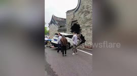 Out-of-control car smashes through building's wall in China, injuring three