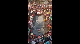 Hindu priest trips face-first onto hot coals during fire-walking ritual