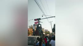 Myanmar residents cover CCTV cameras with sacks and old clothes during protests