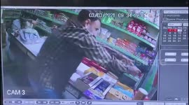 Chilling footage shows shopkeeper firing back at armed robber in India