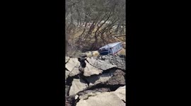 Resident records damage after floods see parking lot destroyed by landslide in Kentucky, US