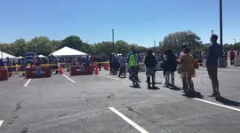 Dozens queue as vaccination site opens at Valencia College in Orlando, Florida.
