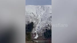 Spectacular moment avalanche crashes down mountain in Alaska