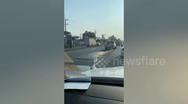Lazy driver drags construction site steel mesh along the road