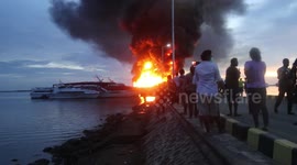 Passenger motor boat FAJAR BARU-8 burns at Sorong Port in Sorong, Indonesia