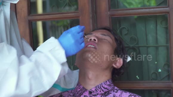 Having Homecare Antigen Swab Test For Family