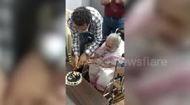 100-year-old woman celebrates birthday with healthcare workers after receiving COVID-19 vaccine in western India