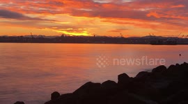 Watch dazzling time-lapse as the sun rises above the Port of Seattle in Washington State