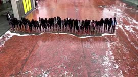 Chinese students stand in line to mop ground with perfect cohesion
