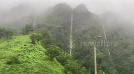 Flood Oahu | Flash Flood on Oahu | Police escorting heavy equipment to clear road