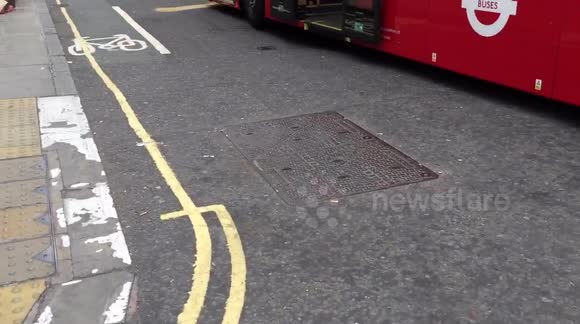 Car wedged between busses