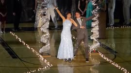 Prom couple make skating entrance