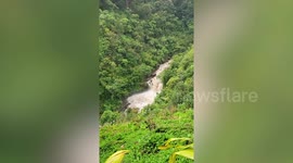 Hawaii stream roars down hillside during floods