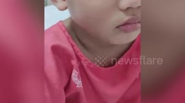 Thai boy breathes with tooting sound after swallowing toy whistle attached to balloon