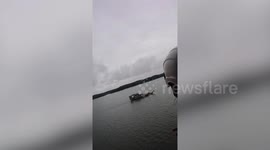 Seafarers onboard boat whistle a tune to call floating store