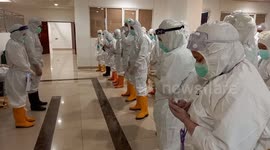Doctors pray during coronavirus epidemic in Jakarta, Indonesia
