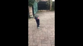 One year old boy celebrates a goal in lockdown back garden football. BBC