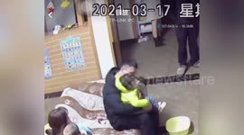 Quick-thinking father catches 2-year-old daughter as she falls from sofa in southern China