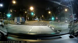 Dog almost hit by a truck after running in the middle of the road owner struggled to catch it