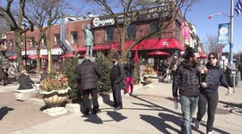 Crowded patios and sidewalks in Greektown on the Danforth during first warm spring day in Toronto but the COVID 19 pandemic is still raging on with numbers increasing in Ontario Canada each day