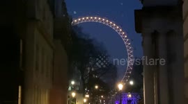 London Eye illuminated for the victoms of Pandemic in the first anniversary of lockdown in the UK