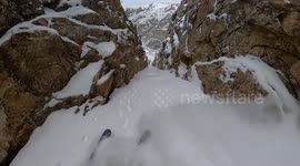 This insane POV video shows the moment a professional freeskier made his way down a natural snow slide that cascades like a waterfall.