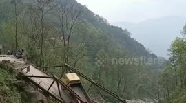 Multiple trucks sink into gorge along with bridge in northeastern India
