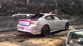 Alabama highway patrol car badly smashed as supercell tornado sweeps southern state