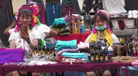 Burmese long-neck tribe refugees in Thailand at the Chiang Mai night bazaar