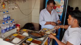 The cook person has preparing for indian special thali for customers at street Hotel in Haridwar Halkipuri