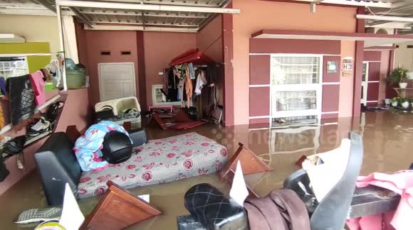 Floods submerge homes after heavy rains hit Indonesia