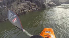 Brave kayaker in Zimbabwe chases crocodile after it steals his friend's foam block