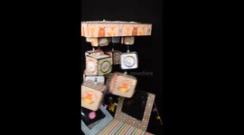 Baby hanging cubes with an exploding box- colourful and shaky