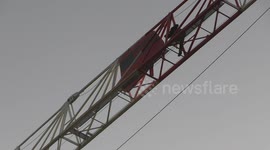 Protester climbs Canning Town crane to hang Black Lives Matter sign