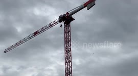 Black live Matter protester settles up on a crane in Canning town