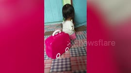 Girl, 2, born without arms or right leg uses her only foot to play with toys and eat food