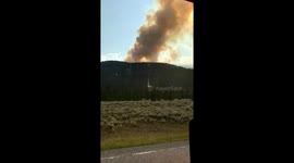 Wildfire and smoke next to Gallatin road in Montana
