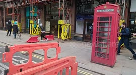 'Kill the Bill' protester smashes phone box with cone in central London