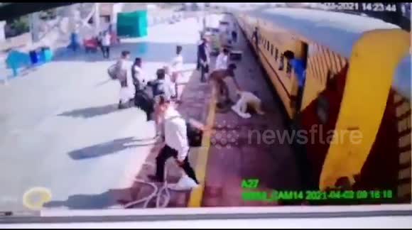 Indian railway cop saves elderly passenger from being crushed under moving train