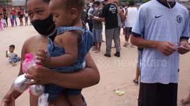 Distribution of easter eggs and food at marmitex in Osasco, Brazil