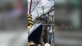 Terrifying moment oil tanker ship crashes into homes along river bank in Thailand