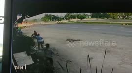 Dramatic moment driver crawls from car crash wreckage with flames raging behind him