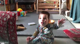 Baby's first encounter with glass, trying to break free from this sorcery