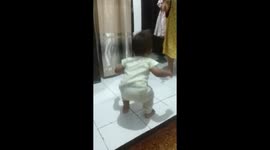 One Year Old Boy Sings While His Grandmother Sings Ondel Ondel In West Jakarta, Indonesia