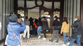 London shoppers queue outside Harrods as non-essential shops reopen