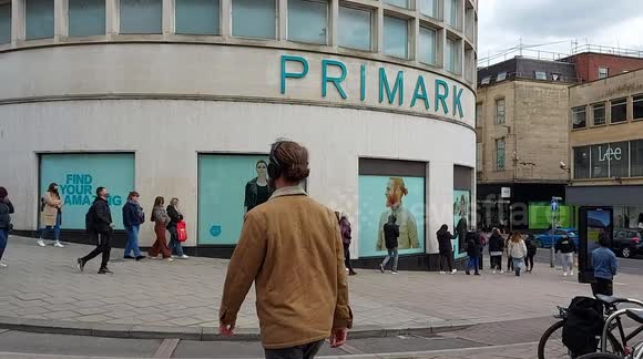 Shoppers queue outside Primark, Bristol on first day of non essential shops opening after lockdown