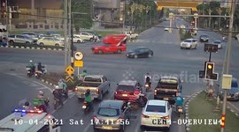 Schoolboy crossing road dodges car before it smashes into traffic light post